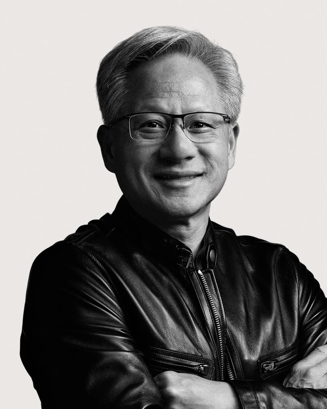 Jensen Huang, NVIDIA founder and CEO, smiling in a black leather jacket.